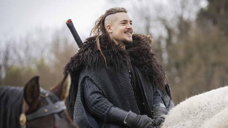 Uhtred smiles on horseback