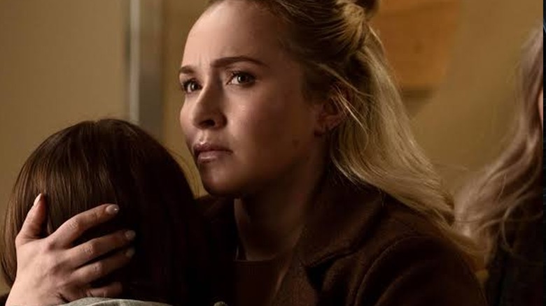 Sarah holds her child in Sleepwalker
