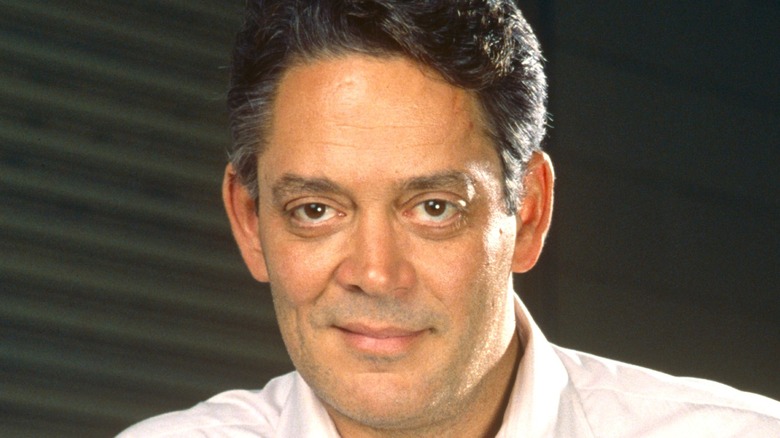 Raul Julia smiling