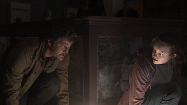 Joel and Ellie hiding on The Last of Us