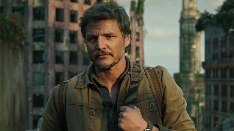 Joel standing in front of Boston in ruins