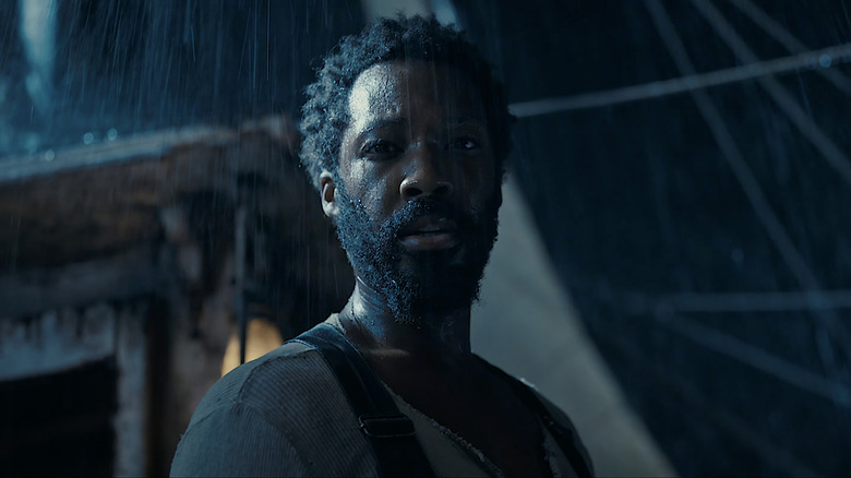 Corey Hawkins in rain on ship
