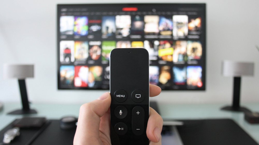 Remote with TV showing streaming service menu