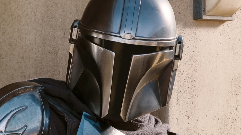 Din Djarin wearing Mandalorian helmet