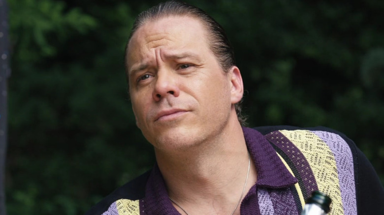 Kosta frowns at party guests