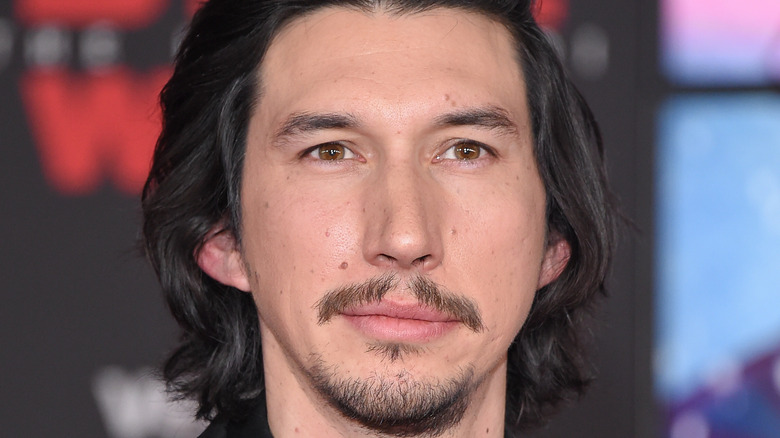 Adam Driver looking into distance 