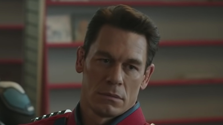 Christopher Smith (aka Peacemaker) (John Cena) frowns inside headquarters in "Peacemaker"
