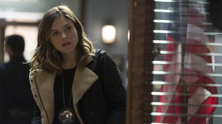 Sophia Bush in dark jacket