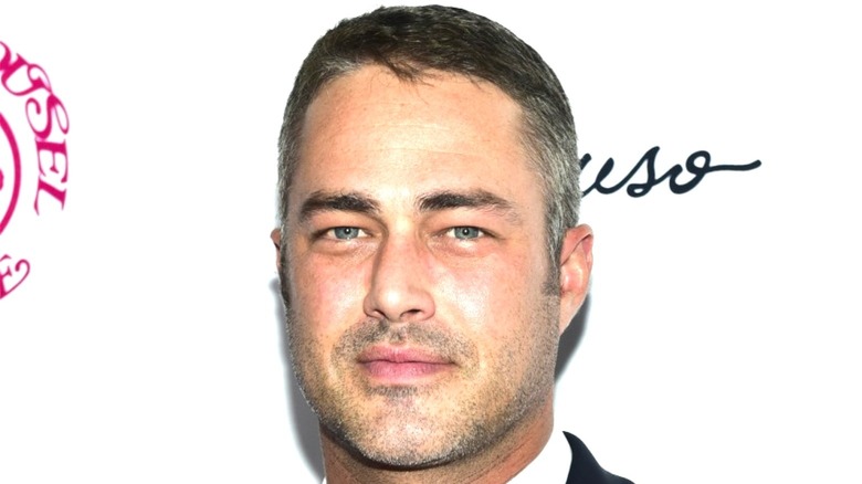 Taylor Kinney looking into camera