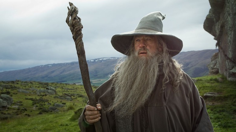 Gandalf the Grey holding his staff in The Hobbit trilogy