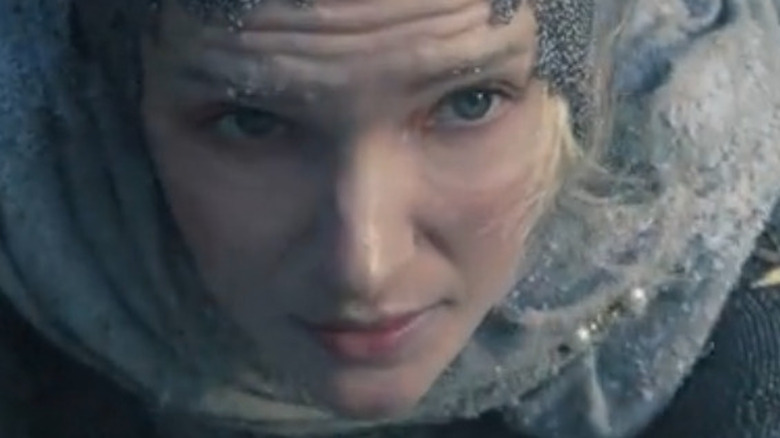 Galadriel scales a cliff