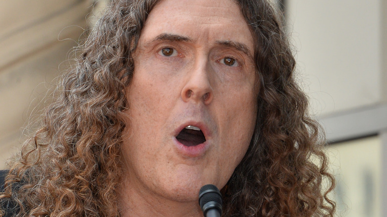 Weird Al speaks into mic