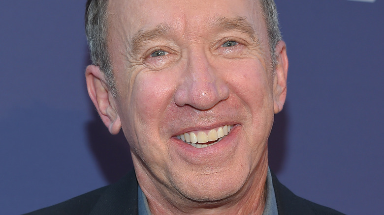 Tim Allen smiling for a press photo