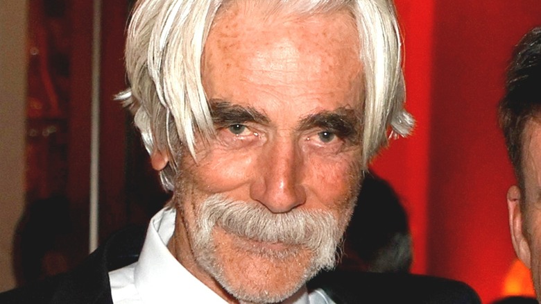 Sam Elliot smiling for photographers