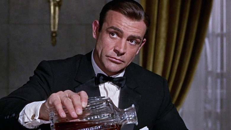 James Bond pours liquor