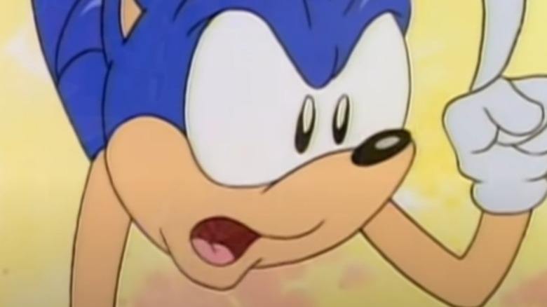 Sonic hangs upside down and attempts to outwit Dr. Robotnik's henchman 