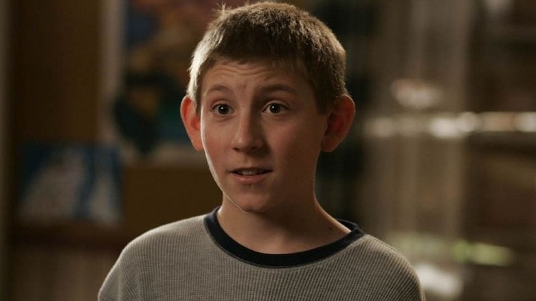 Dewey looks off camera