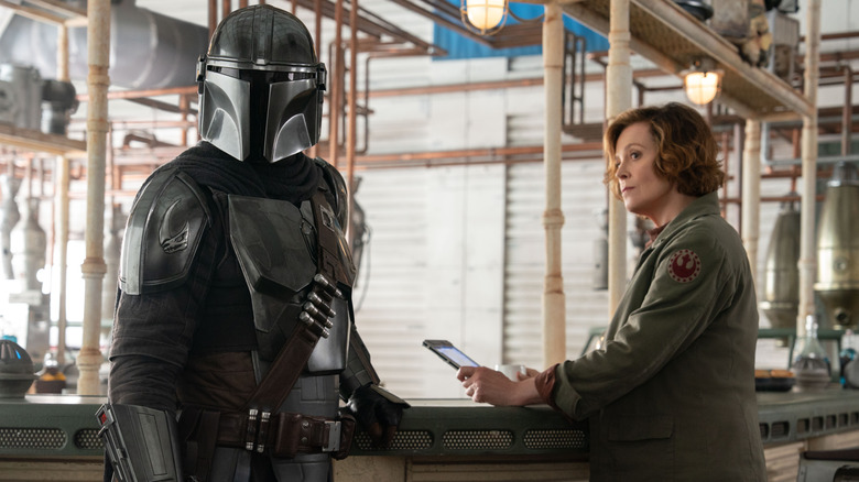Ward looking at Din Djarin in The Mandalorian and Grogu
