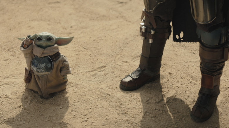 Grogu pointing up next to Din Djarin in The Mandalorian and Grogu