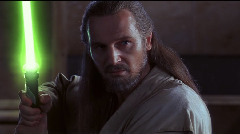 Qui-Gon holding lightsaber