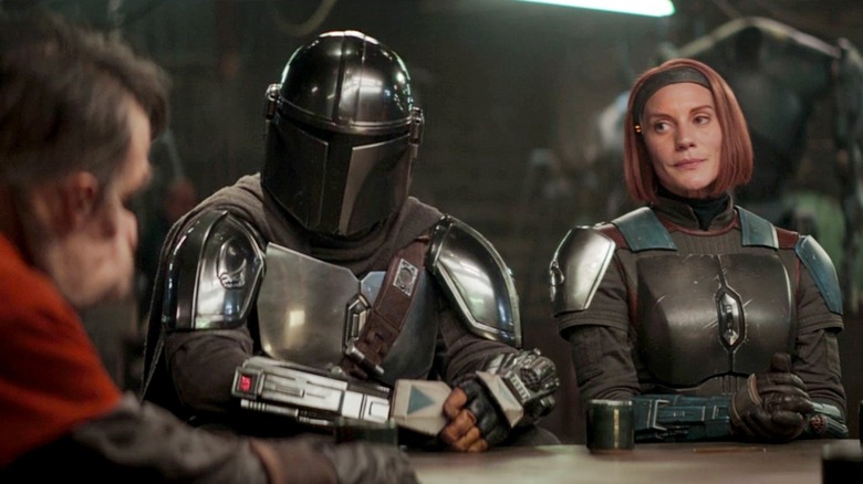 Mando and Bo-Katan questioning an Ugnaught