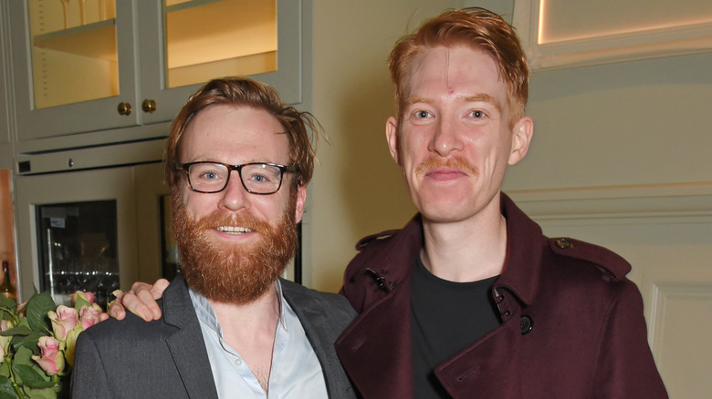 Brian Gleeson and Domhall Gleeson smiling