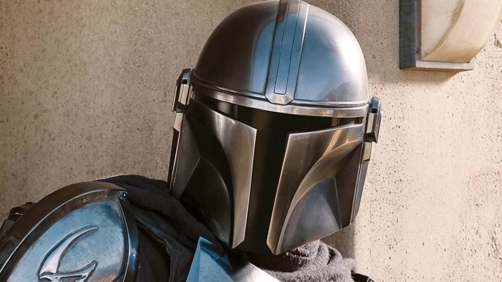 The Mandalorian looking back