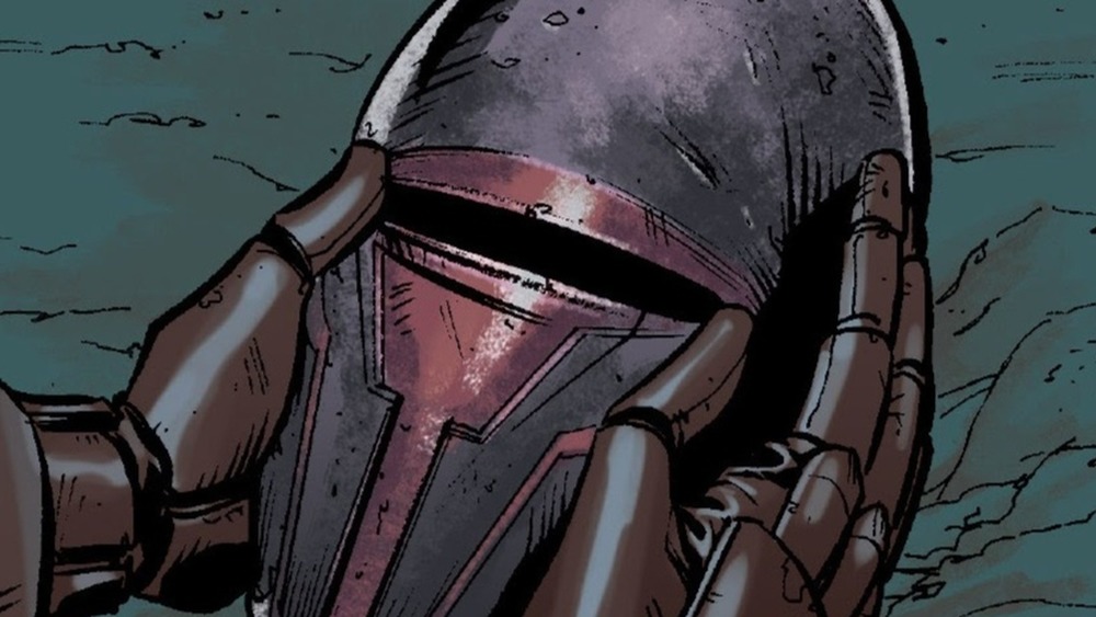Revan holding a Mandalorian helmet