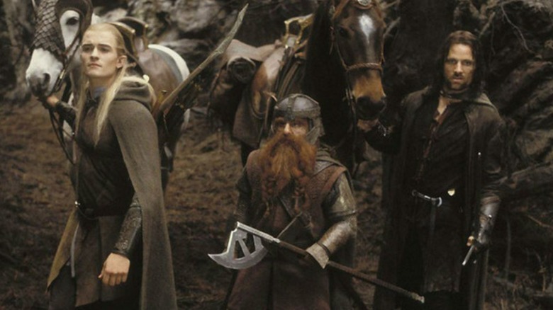 Legolas, Gimli, and Aragorn near their horses