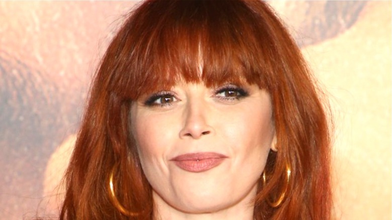 Natasha Lyonne smiles