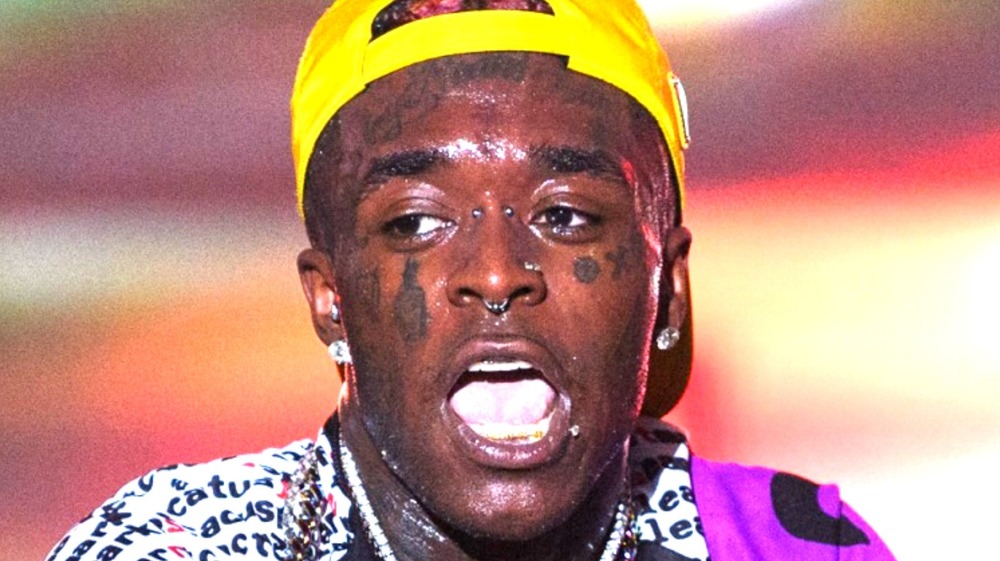 Lil Uzi Vert with yellow backwards hat