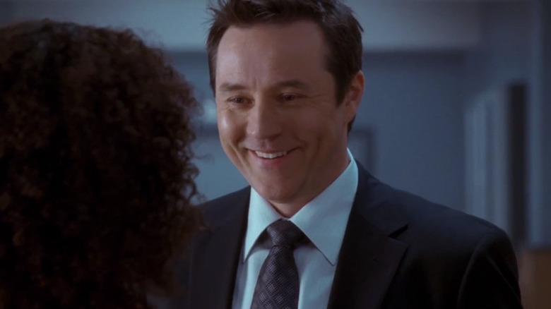 Nick Balco smiling at a coworker