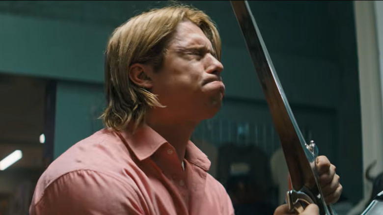 Adam struggle to pull a sword from a statue in Masters of the Universe (2026)