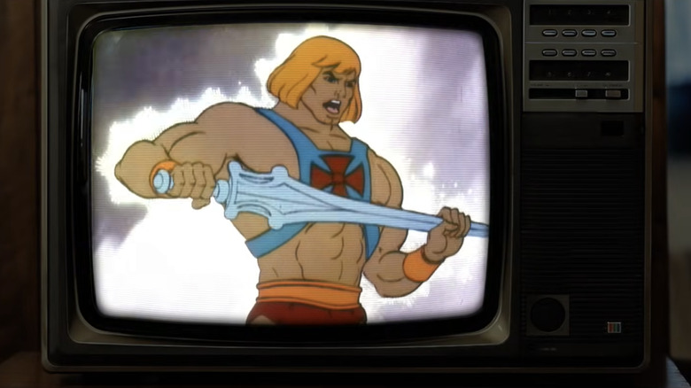 A TV showing the He-Man cartoon