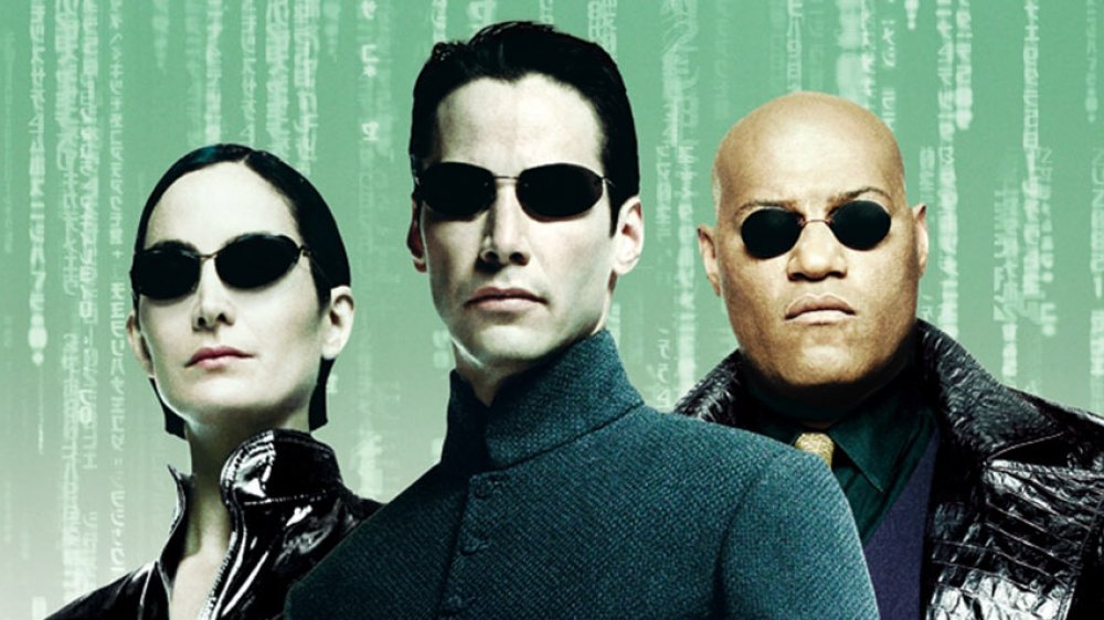 Carrie-Anne Moss, Keanu Reeves, and Lawrence Fishburne as Trinity, Neo, and Orpheus in The Matrix