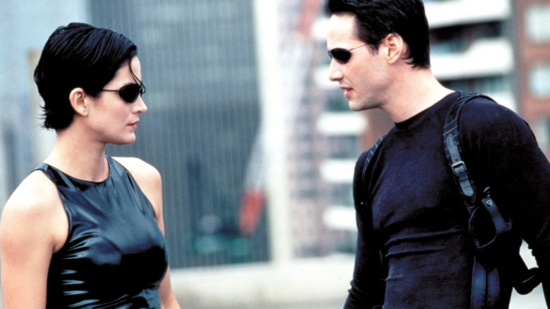Neo and Trinity staring at each other in The Matrix (1999)