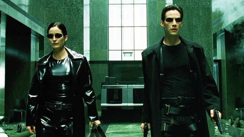 Neo and Trinity prepare for a fight in 'The Matrix' (1999)