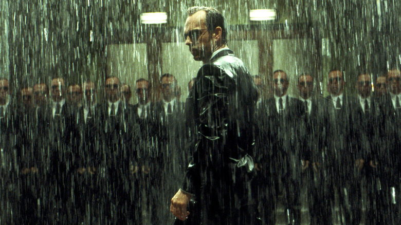 Agent Smith stands in the rain in 'The Matrix Revolutions' (2003)