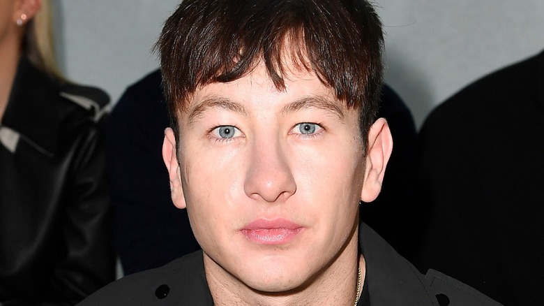 Barry Keoghan poses in a black jacket