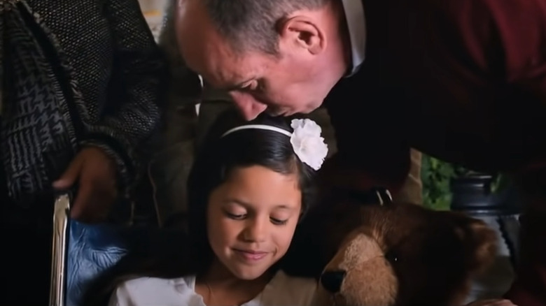 Vice President Rodriguez kisses his daughter on the head in Iron Man 3