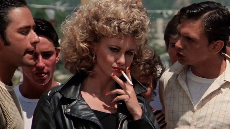 Olivia Newton-John as Sandy smoking