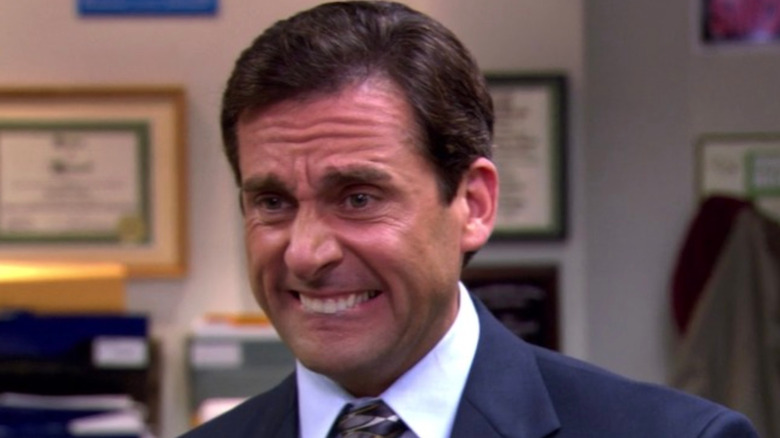 Michael Scott smiles awkwardly