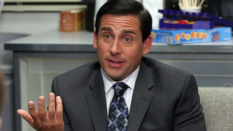 Michael Scott smiles awkwardly