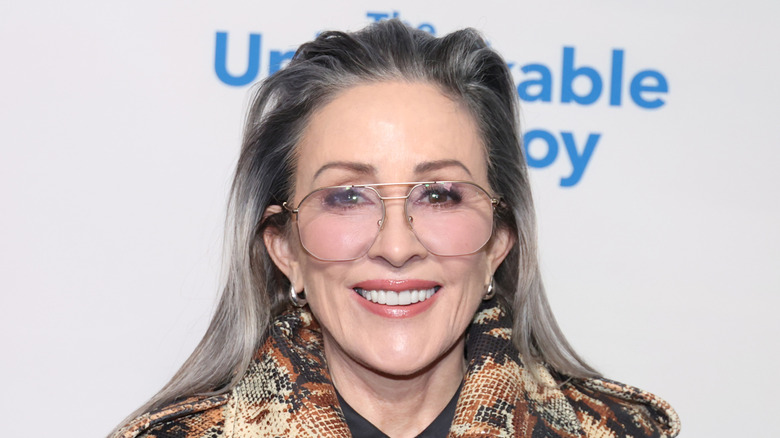 Patricia Heaton with silver hair and large eyeglasses