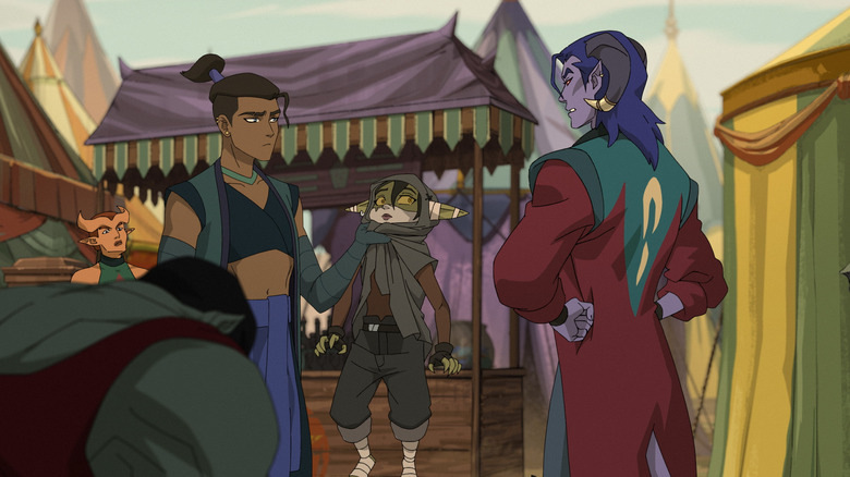 Beau holding Nott the Brave up near Molly at the carnival