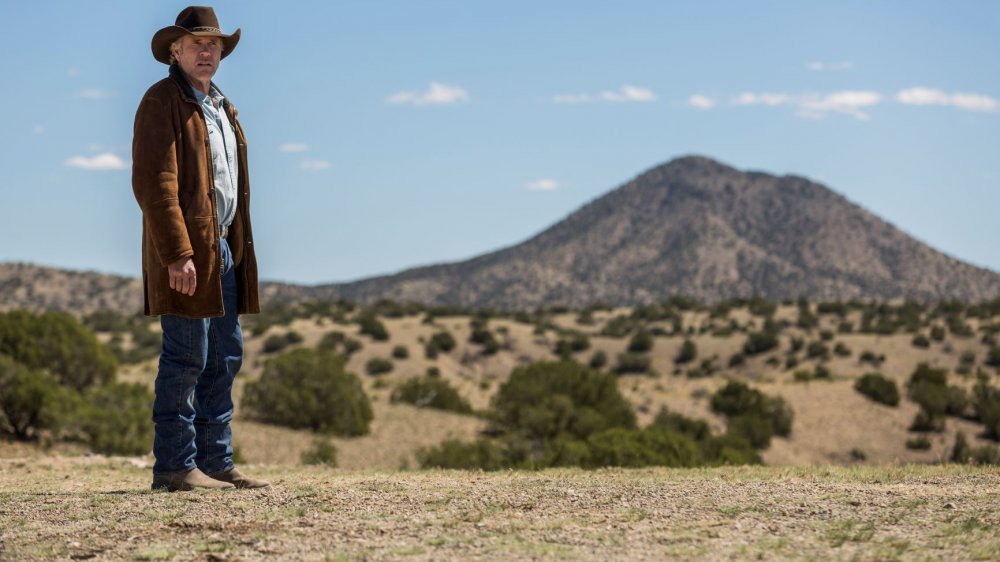 Sheriff Walt Longmire (Robert Taylor) surveys Wyoming on Longmire