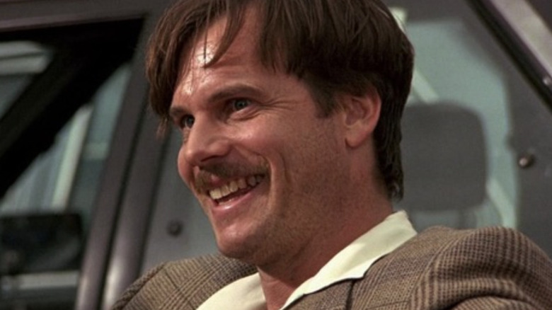 Simon laughing in a car