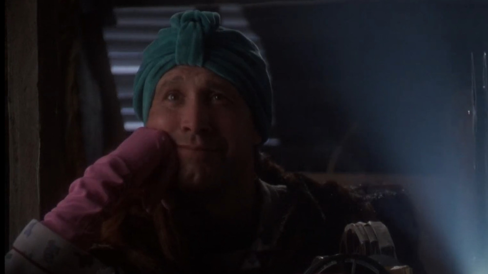 Chevy Chase as Clark, watching home movies in National Lampoon's Christmas Vacation