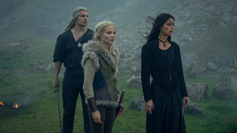 Geralt, Ciri, and Yennefer stand at the ready