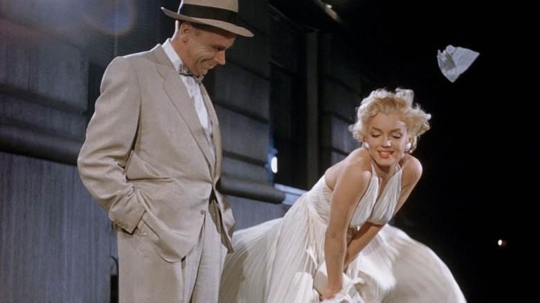 The Girl tries to hold down her skirt in "The Seven Year Itch" (1955)